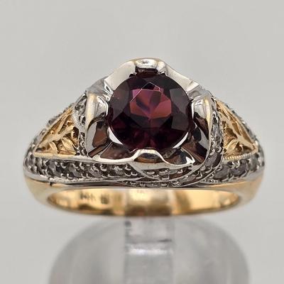 Lot 25: 14k Gold Ring with Garnet Center Stone and Diamond Accent Stones / Size 6.5 / 8g