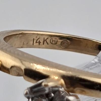 Lot 34: 14k Gold Wrap Ring with Baguette and Round Accent Diamonds - 2g / Size 5.5