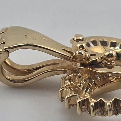 Lot 39: 14k Heart Shaped Gold Pendant with Baguette and Round Diamonds - 3g