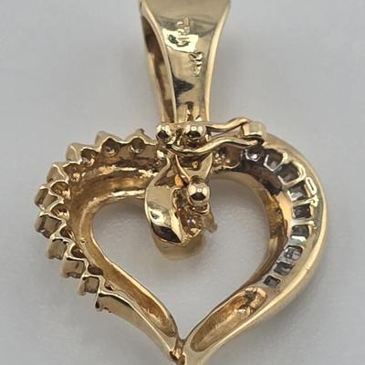 Lot 39: 14k Heart Shaped Gold Pendant with Baguette and Round Diamonds - 3g