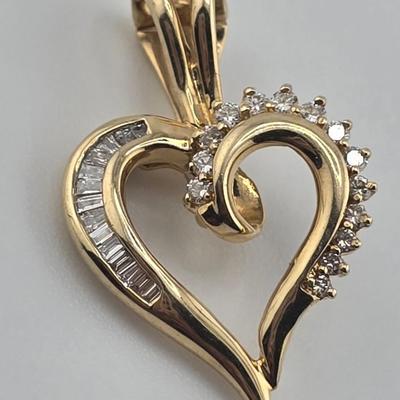 Lot 39: 14k Heart Shaped Gold Pendant with Baguette and Round Diamonds - 3g