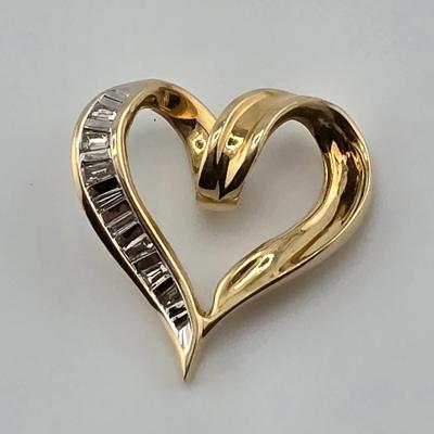 Lot 43: 14k Gold Heart Shaped Pendant with Baguette Diamonds / 1g