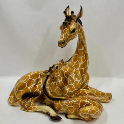 Sale Photo Thumbnail #16: Wonderful attention to detail. This porcelain ceramic statue is in very good condition.