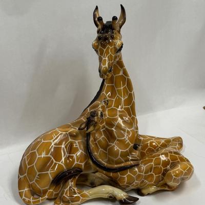 Sale Photo Thumbnail #14: Wonderful attention to detail. This porcelain ceramic statue is in very good condition.