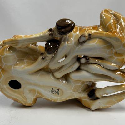 Sale Photo Thumbnail #18: Wonderful attention to detail. This porcelain ceramic statue is in very good condition.
