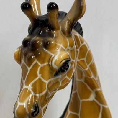 Sale Photo Thumbnail #1: Wonderful attention to detail. This porcelain ceramic statue is in very good condition.