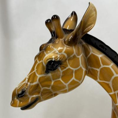 Sale Photo Thumbnail #3: Wonderful attention to detail. This porcelain ceramic statue is in very good condition.