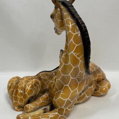 Sale Photo Thumbnail #12: Wonderful attention to detail. This porcelain ceramic statue is in very good condition.
