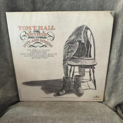 Sale Photo Thumbnail #380: "The Rhymer and Other Five and Dimers" by Tom T. Hall.
Here is information about the album:
Release: This vinyl LP was released in 1973 by Mercury Records and was Tom T. Hall's eighth album for the label.
Genre & Style: It is categorized under the Folk, W