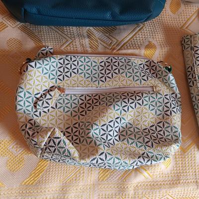 2 PURSES AND A TOTE WITH A MATCHING SMALLER BAG