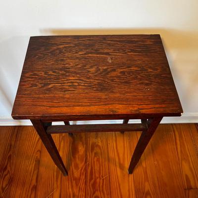 Sale Photo Thumbnail #158: Dark stain oak table.
Measures 17”W x 12”D x 28”H