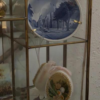 Decorative glass display includes collectibles