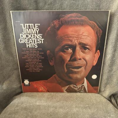 Sale Photo Thumbnail #396: "Little" Jimmy Dickens' Greatest Hits, a compilation album by the legendary country music artist, "Little" Jimmy Dickens. 
Here's some information about the album:
Release and Chart Performance: This Greatest Hits album was released in 1966 on Columbia Re