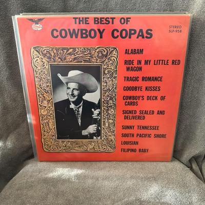 Sale Photo Thumbnail #264: "The Best of Cowboy Copas", a compilation album by American country music singer Lloyd Estel "Cowboy" Copas. 
Album Information:
Artist: Cowboy Copas.
Title: The Best of Cowboy Copas.
Format: The image displays a vinyl LP, though CD versions also exist.
L