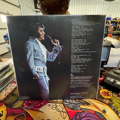 Sale Photo Thumbnail #79: "Elvis In Concert", a live album by Elvis Presley released posthumously in October 1977 by RCA Records. 
Here are some details about the album:
Release & Context: It was released in conjunction with a CBS-TV special of the same name, featuring some of Elv