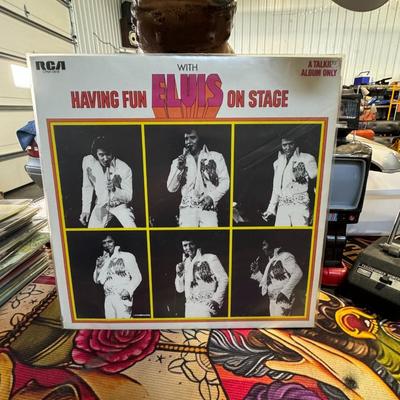 Sale Photo Thumbnail #170: Having Fun with Elvis on Stage by Elvis Presley, released in 1974. This unique album stands out in Elvis's discography for several reasons: 
Spoken Word Content: Unlike his other albums, Having Fun with Elvis on Stage contains no music. It is composed ent