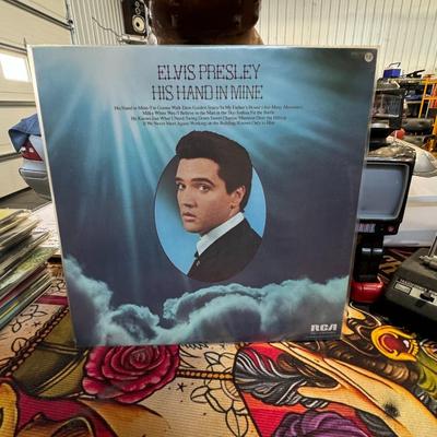 Sale Photo Thumbnail #174: "His Hand in Mine" by Elvis Presley. 
Here are some details about the album:
Release Date: It was released on November 23, 1960, by RCA Victor.
Genre: It was Elvis Presley's first of three gospel albums and features his interpretations of traditional hymn