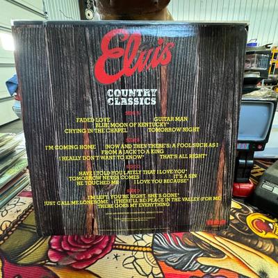 Sale Photo Thumbnail #177: "Elvis Country Classics," a double LP vinyl record set by Elvis Presley. 
Here's more information about this album:
Artist and Title: Elvis Presley - Country Classics.
Format and Label: It's a double LP (long-playing) vinyl record set released by RCA Reco