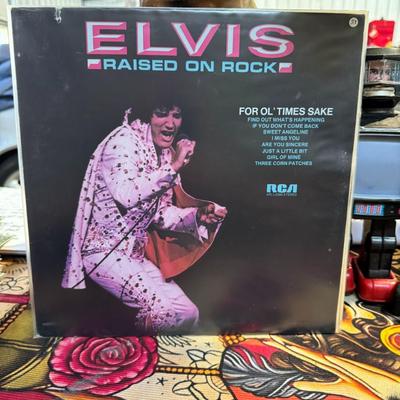Sale Photo Thumbnail #178: Elvis Presley's 1973 vinyl LP, Raised on Rock / For Ol' Times Sake. 
Here is some information about the album:
Release Details: RCA Victor released the album in October 1973, with the catalog number APL1-0388.
Recording Location: Initial vocal tracks were