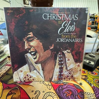 Sale Photo Thumbnail #184: "Christmas to Elvis from the Jordanaires". This album is a tribute Christmas album released by The Jordanaires in 1978. 
About the Album:
Artists: The Jordanaires, famous for being Elvis Presley's original backing vocal group, are the primary artists. The