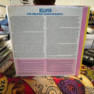 Sale Photo Thumbnail #118: Elvis Presley's "The Greatest Show On Earth" vinyl LP.
Here's some information about this record:
Artist: Elvis Presley.
Album Title: The Greatest Show On Earth.
Release Information: It's an LP (long play) vinyl record, released by RCA Special Products, a
