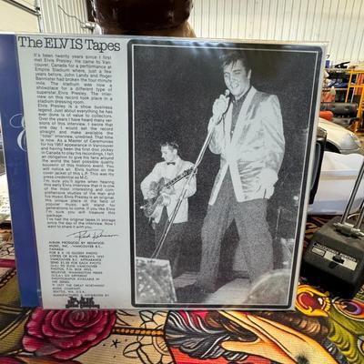 Sale Photo Thumbnail #53: "The ELVIS Tapes", a vinyl LP featuring interview recordings of Elvis Presley. 
Here's more about this album:
Content: The LP primarily features a recording of a press conference given by Elvis Presley prior to his performance at the Empire Stadium in Van