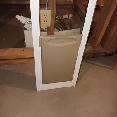 PET DOOR FOR A SLIDING GLASS DOOR AND A LARGE PET KENNEL