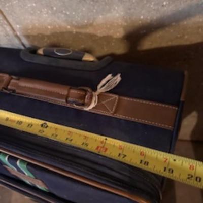 TOMMY HILFIGER AND A 2ND SUITCASE BOTH ON 4 WHEELS AND A LUGGAGE RACK