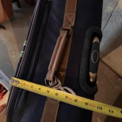 TOMMY HILFIGER AND A 2ND SUITCASE BOTH ON 4 WHEELS AND A LUGGAGE RACK