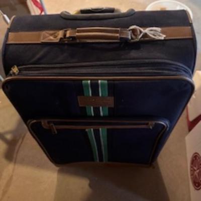 TOMMY HILFIGER AND A 2ND SUITCASE BOTH ON 4 WHEELS AND A LUGGAGE RACK