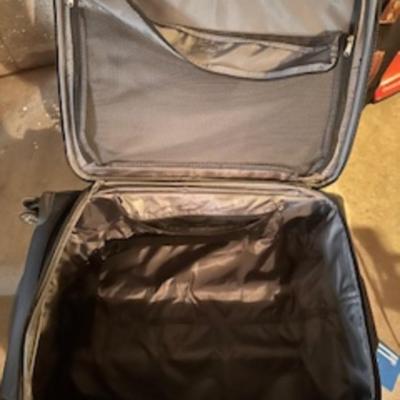 TOMMY HILFIGER AND A 2ND SUITCASE BOTH ON 4 WHEELS AND A LUGGAGE RACK