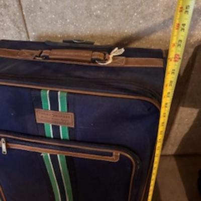 TOMMY HILFIGER AND A 2ND SUITCASE BOTH ON 4 WHEELS AND A LUGGAGE RACK