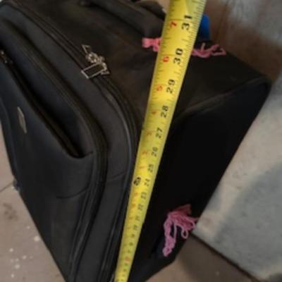 TOMMY HILFIGER AND A 2ND SUITCASE BOTH ON 4 WHEELS AND A LUGGAGE RACK