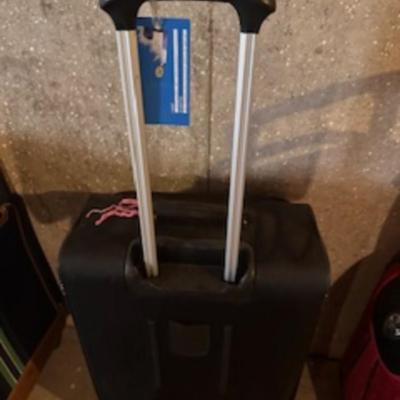 TOMMY HILFIGER AND A 2ND SUITCASE BOTH ON 4 WHEELS AND A LUGGAGE RACK