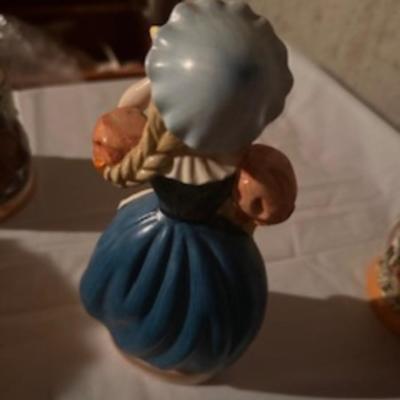 BEER STEINS, SWISS GIRL FIGURINE AND A CARVED CANDLE