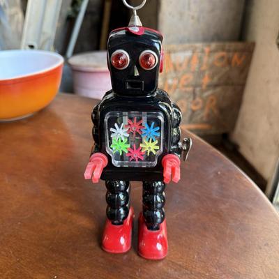 Sale Photo Thumbnail #144: This is for a vintage wind up robot. It needs to have the wind up part text. Other than that it’s in good condition.