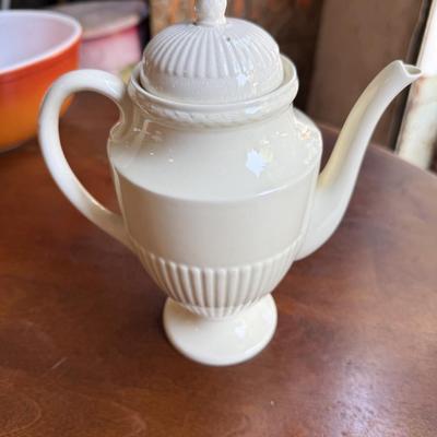 Sale Photo Thumbnail #160: This is for a cream colored wedge Wood teapot. It’s on the lighter side of cream close to white. It’s an excellent condition. This would be a beautiful addition to your collection.