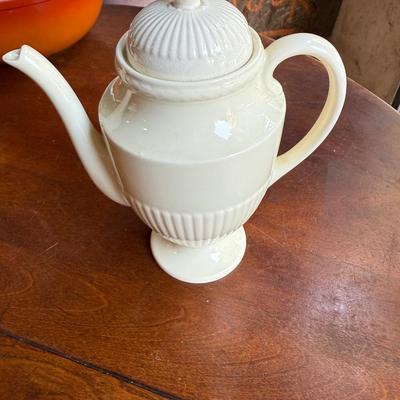Sale Photo Thumbnail #161: This is for a cream colored wedge Wood teapot. It’s on the lighter side of cream close to white. It’s an excellent condition. This would be a beautiful addition to your collection.