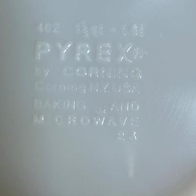 Sale Photo Thumbnail #169: This is for three Pyrex bowls. Two are orange and one is a cream, yellow type color with fruit marked on it.