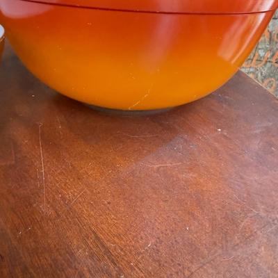 Sale Photo Thumbnail #165: This is for three Pyrex bowls. Two are orange and one is a cream, yellow type color with fruit marked on it.