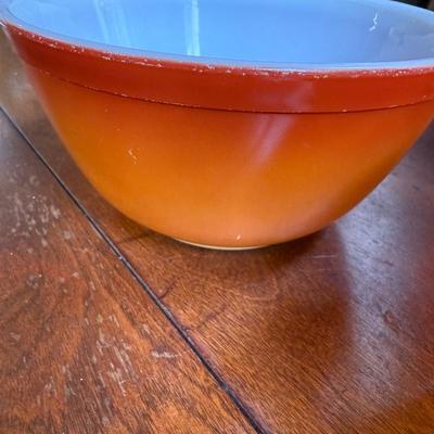 Sale Photo Thumbnail #167: This is for three Pyrex bowls. Two are orange and one is a cream, yellow type color with fruit marked on it.