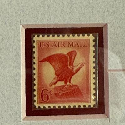 Sale Photo Thumbnail #147: Matted and Framed Print and Postage Stamps:  3cent and 6 cent Eagle Air Mail stamps, also a 29 cent Eagle US Savings Bond stamp. Framed size approx. 22" x 16".