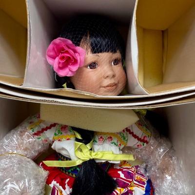 Sale Photo Thumbnail #72: New in original box, comes with original documentation and tags.  Wearing a traditional costume from Spain. Still wrapped in original bubble wrap.