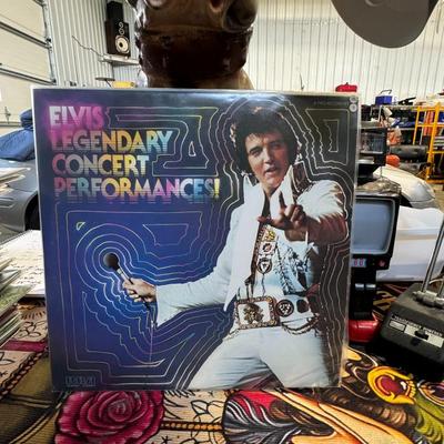 Sale Photo Thumbnail #206: "Elvis Legendary Concert Performances!" by Elvis Presley.
Here's more information about this record:
Title and Artist: The album is titled "Elvis Legendary Concert Performances!" and features the iconic American singer Elvis Presley.
Release Information: 