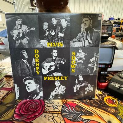 Sale Photo Thumbnail #196: Elvis Presley Dorsey Shows LP, a compilation of Elvis Presley's performances on the Dorsey Brothers' "Stage Show" in 1956. 
Here's more information about this album:
Content: The album features live recordings from Elvis's early television appearances on 
