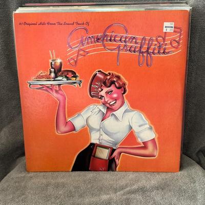 Sale Photo Thumbnail #533: "41 Original Hits from the Sound Track of American Graffiti", the official soundtrack album for the 1973 film American Graffiti. 
Here's some information about this iconic soundtrack:
Release & Success: Released in 1973 alongside the film, it achieved tri