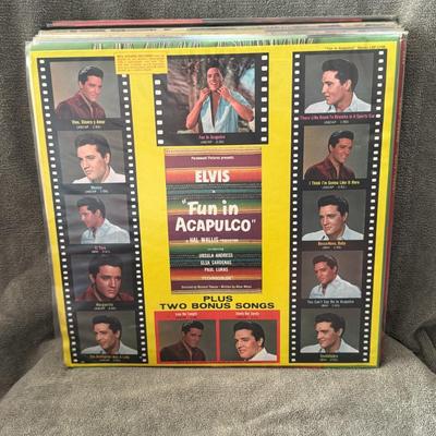 Sale Photo Thumbnail #30: "Fun in Acapulco" LP, a soundtrack album by Elvis Presley released in 1963. The album includes songs from the film of the same name and features two bonus tracks. 
Details of the "Fun in Acapulco" Soundtrack LP:
Artist: Elvis Presley.
Album Title: Fun in 