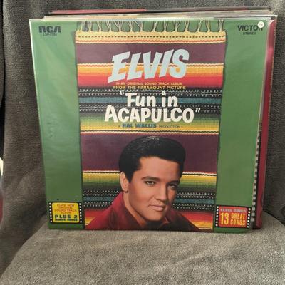 Sale Photo Thumbnail #31: "Fun in Acapulco" LP, a soundtrack album by Elvis Presley released in 1963. The album includes songs from the film of the same name and features two bonus tracks. 
Details of the "Fun in Acapulco" Soundtrack LP:
Artist: Elvis Presley.
Album Title: Fun in 