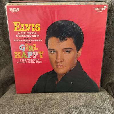 Sale Photo Thumbnail #29: "Girl Happy," the original soundtrack album for the 1965 American musical film starring Elvis Presley. 
Here's more information about the album and film:
Album Details: Released by RCA Victor Records in March 1965 (though the exact date is disputed), "Gir