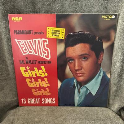 Sale Photo Thumbnail #1: Elvis Presley's Girls! Girls! Girls!. 
Here's some information about this album:
Album Type and Release: It is the soundtrack album for the 1962 film of the same name starring Elvis Presley, released by RCA Victor Records in November 1962.
Catalog Number: